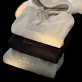 Sudadera con capucha y bolsillo delantero, corte holgado, talla 8XL, estampado de letras caladas; moda para hombres y para parejas.